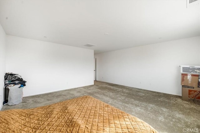 spare room with visible vents and carpet flooring