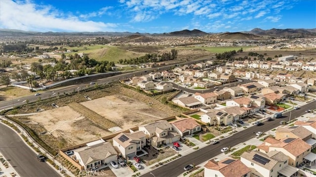 drone / aerial view featuring a mountain view and a residential view