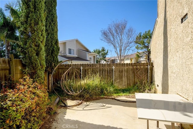 view of patio / terrace featuring fence