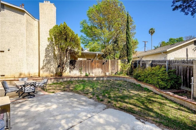 view of patio with outdoor dining area and a fenced backyard