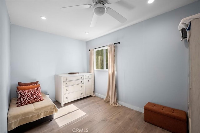 bedroom with a ceiling fan, light wood-type flooring, baseboards, and recessed lighting