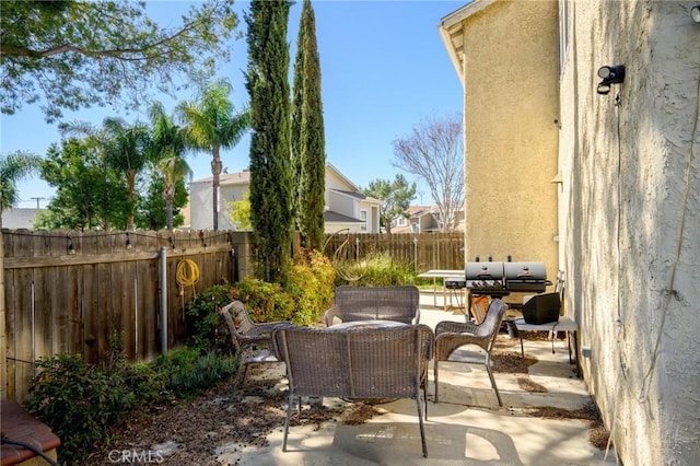 view of patio / terrace featuring a fenced backyard and an outdoor living space