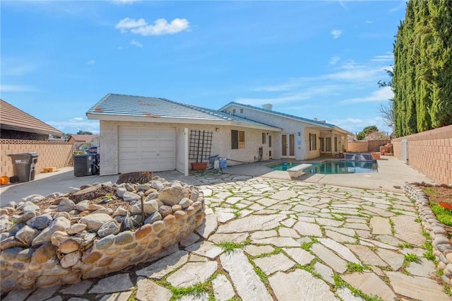 back of house featuring a patio area, a fenced backyard, central AC unit, and a fenced in pool