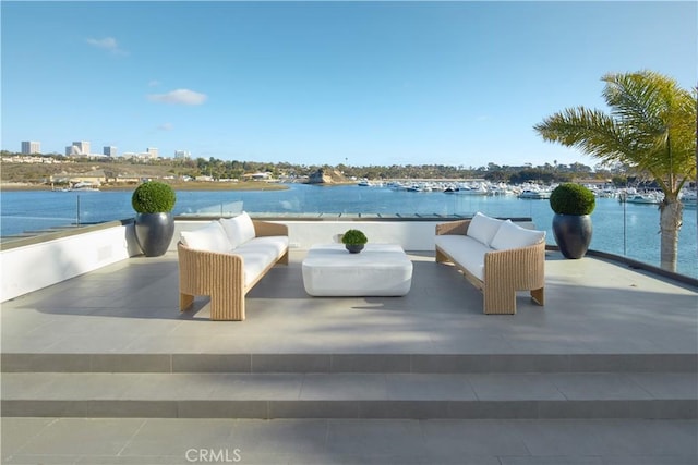 view of patio with an outdoor hangout area and a water view
