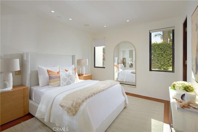 bedroom with light wood-style flooring and recessed lighting