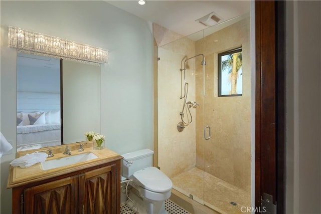 ensuite bathroom with visible vents, a shower stall, toilet, vanity, and ensuite bath