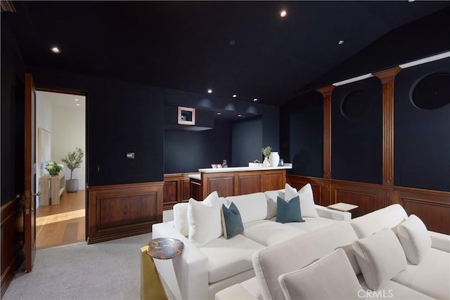 home theater with vaulted ceiling, recessed lighting, decorative columns, and light carpet