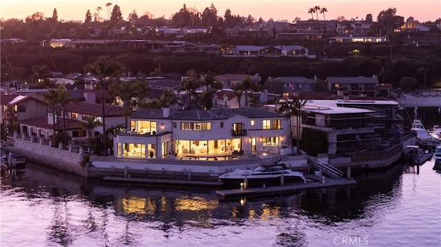 aerial view at dusk with a water view