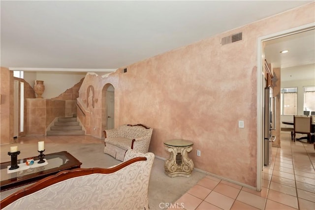 lobby featuring stairs and visible vents