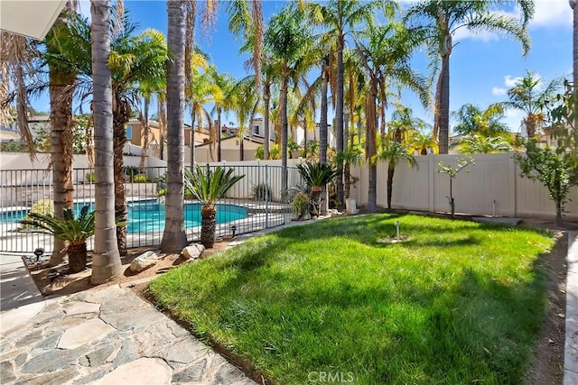 view of yard featuring a fenced backyard and a fenced in pool