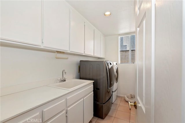 laundry room with light tile patterned floors, recessed lighting, cabinet space, a sink, and independent washer and dryer