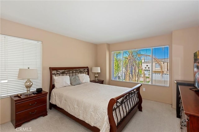 bedroom with light colored carpet