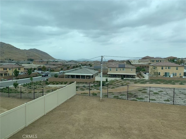 exterior space with a mountain view and a residential view