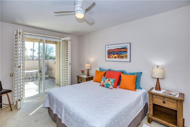 carpeted bedroom featuring access to outside and a ceiling fan