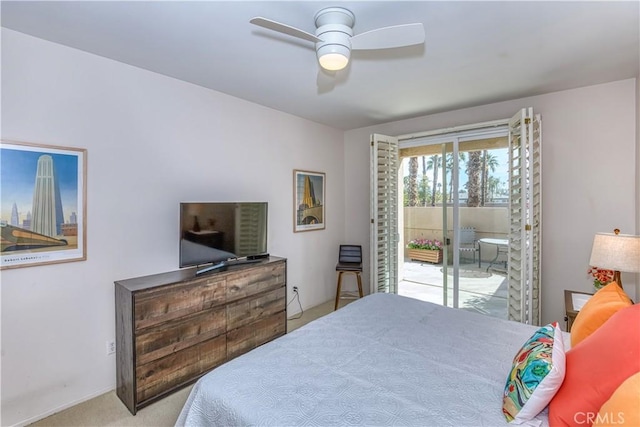 carpeted bedroom with access to outside and a ceiling fan