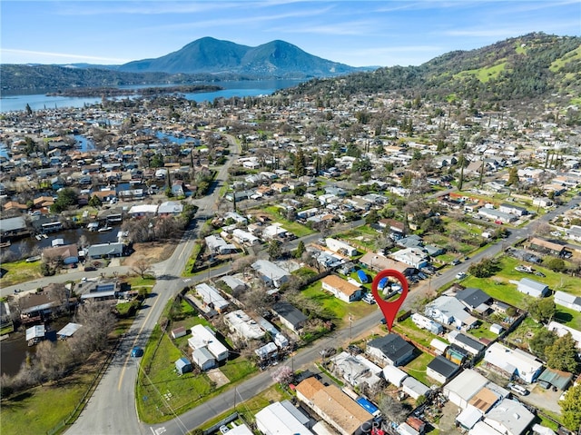 aerial view with a residential view and a water and mountain view