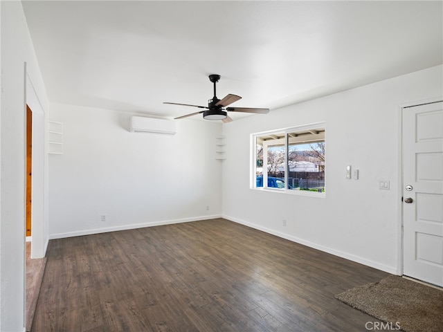 empty room featuring ceiling fan, baseboards, dark wood-type flooring, and an AC wall unit