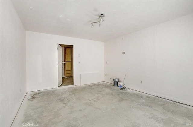 empty room featuring unfinished concrete flooring