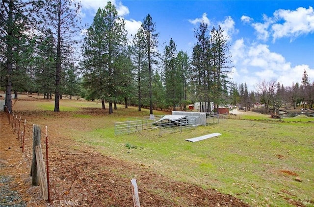 view of home's community featuring fence