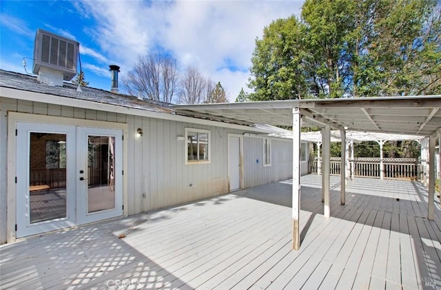 wooden deck with fence, central AC, and french doors