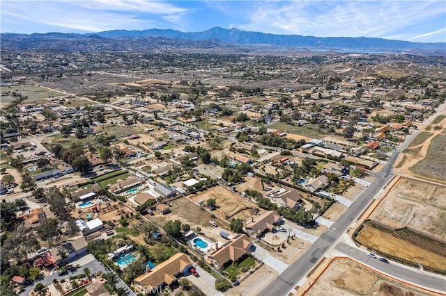 birds eye view of property with a mountain view