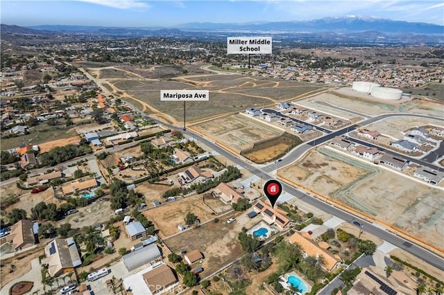 birds eye view of property featuring a mountain view