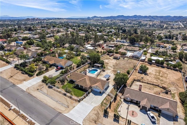 birds eye view of property with a mountain view