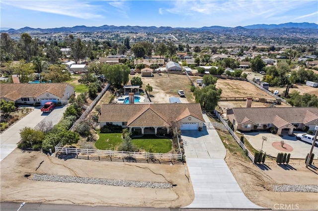 drone / aerial view with a mountain view and a residential view