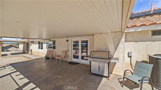 view of patio featuring french doors and grilling area