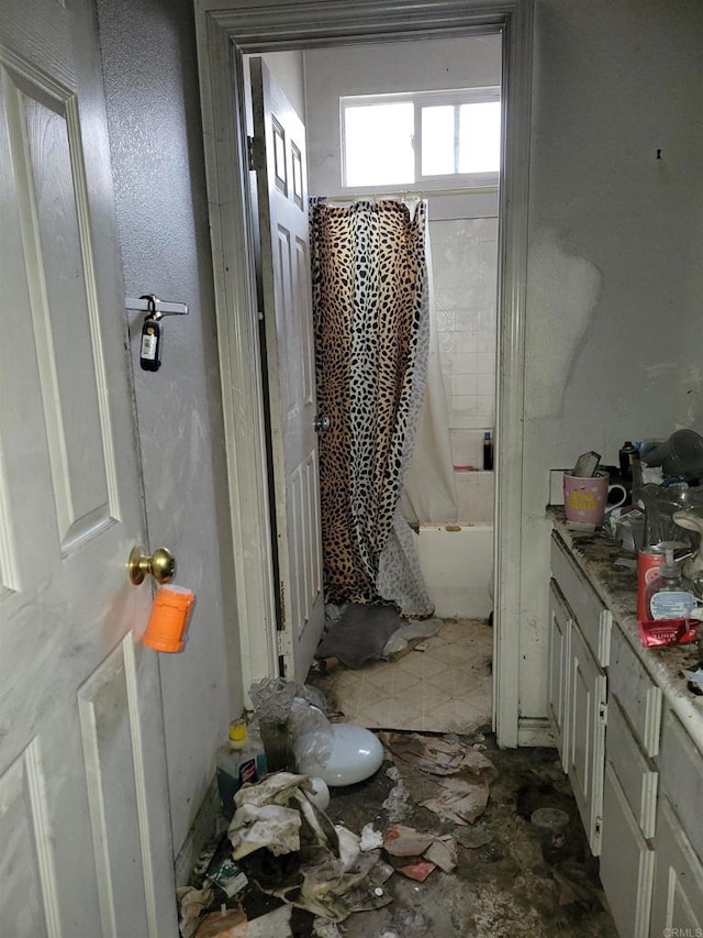 bathroom with vanity and shower / bath combo with shower curtain