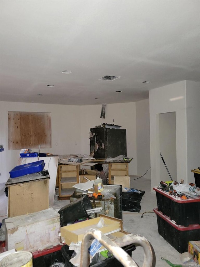 interior space featuring concrete flooring and visible vents