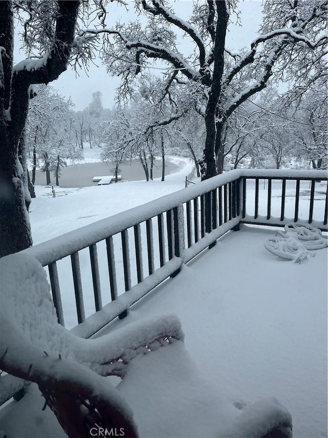 view of snow covered deck