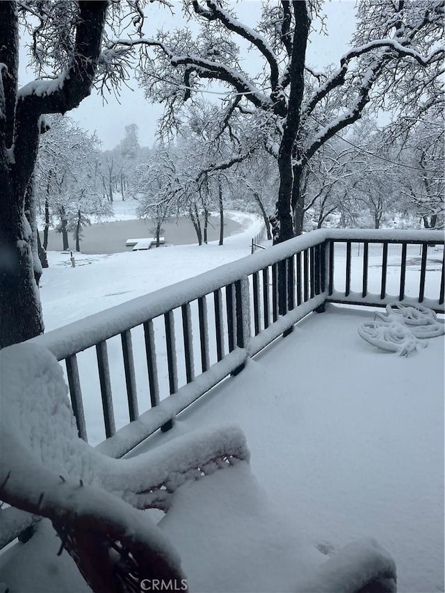 view of snow covered deck