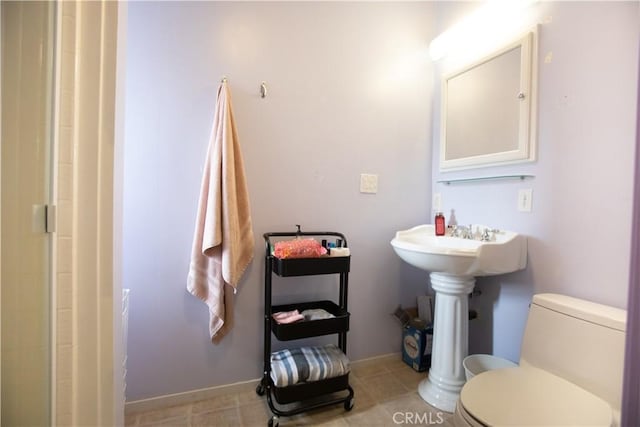 bathroom featuring toilet and walk in shower
