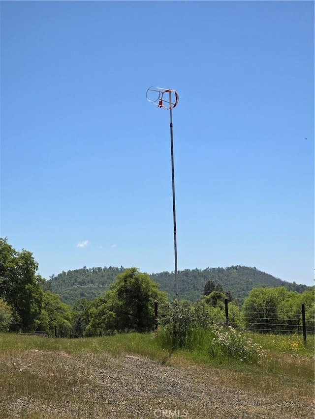view of mountain feature featuring a forest view