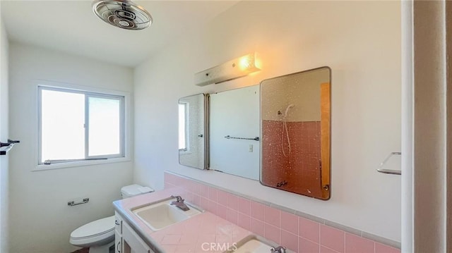 bathroom with visible vents, vanity, and toilet