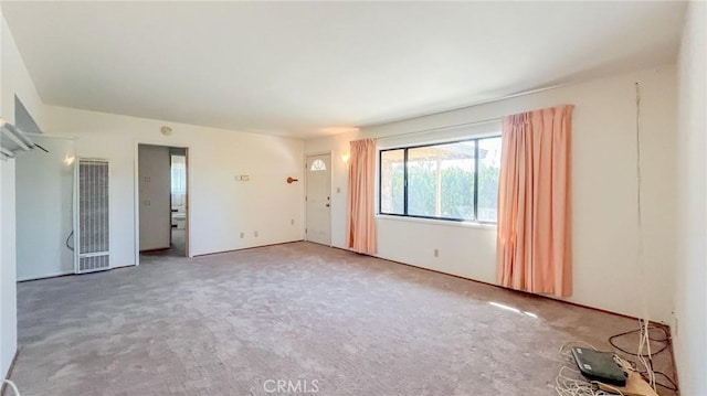 unfurnished room with carpet flooring