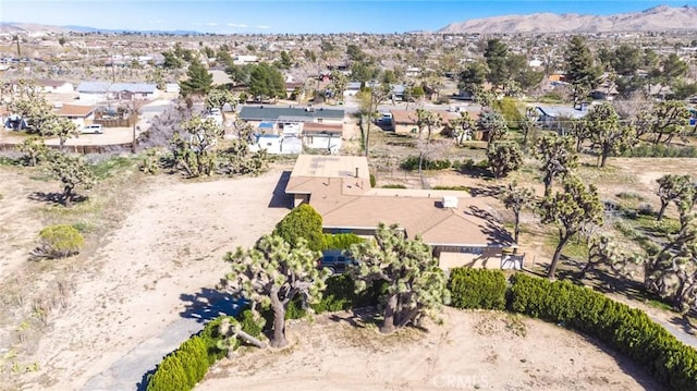 drone / aerial view with a residential view and a mountain view