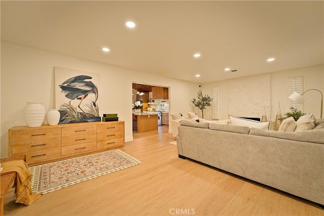 living room featuring recessed lighting and light wood-style floors