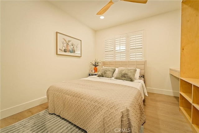 bedroom with ceiling fan, baseboards, wood finished floors, and recessed lighting