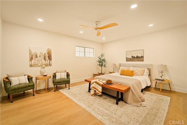 bedroom featuring a ceiling fan, recessed lighting, wood finished floors, and baseboards