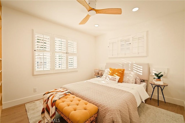 bedroom featuring recessed lighting, baseboards, wood finished floors, and a ceiling fan