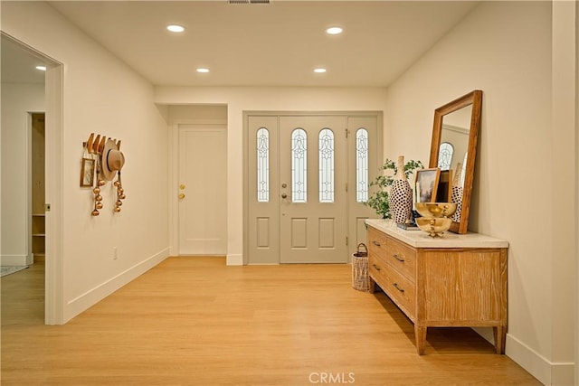 foyer entrance featuring visible vents, recessed lighting, baseboards, and light wood-style floors