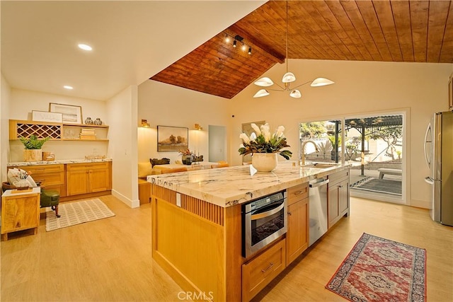 kitchen featuring a sink, stainless steel appliances, light wood-style floors, and wood ceiling