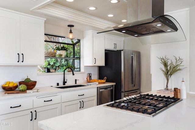 kitchen with stainless steel appliances, a sink, white cabinets, ornamental molding, and island exhaust hood