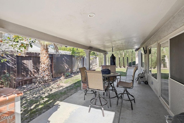 view of patio / terrace with outdoor dining space and a fenced backyard