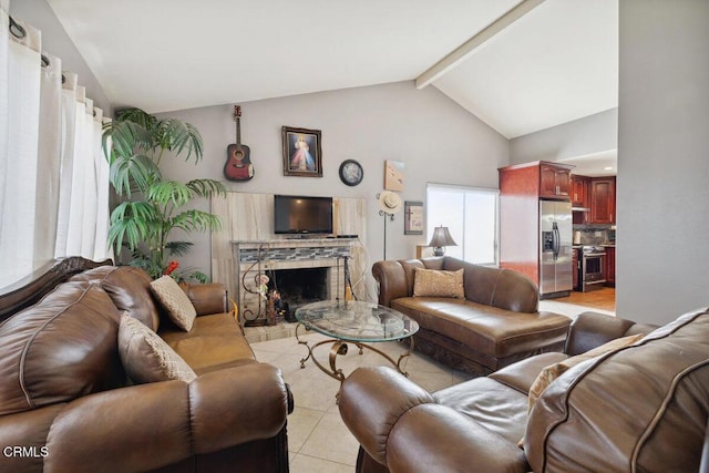 living area featuring light tile patterned flooring, a fireplace, and lofted ceiling with beams