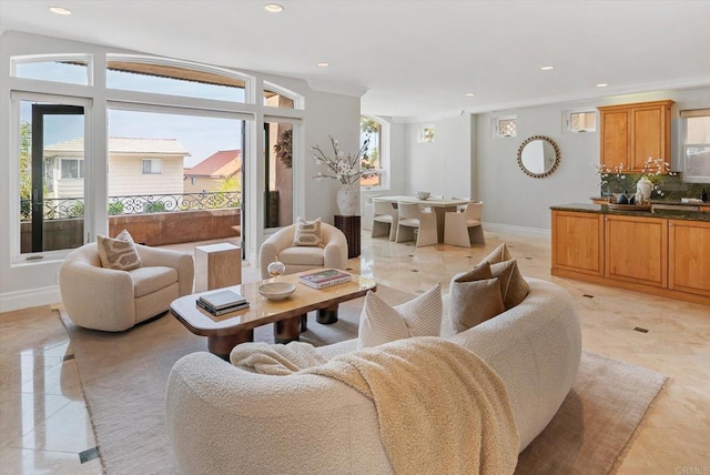 living room featuring baseboards and recessed lighting