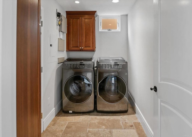 laundry room with cabinet space, baseboards, stone finish floor, washing machine and dryer, and recessed lighting