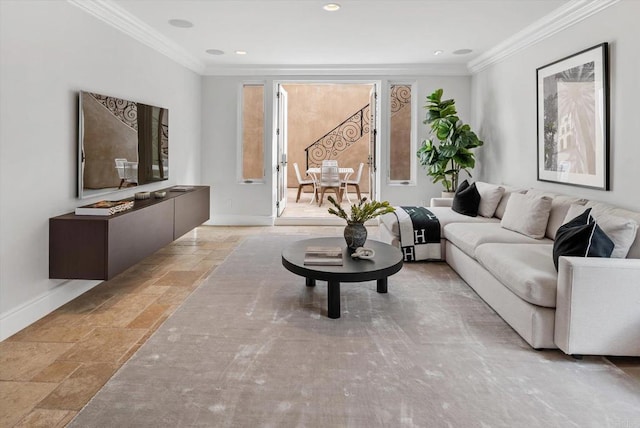 living room featuring stone tile floors, baseboards, crown molding, and recessed lighting